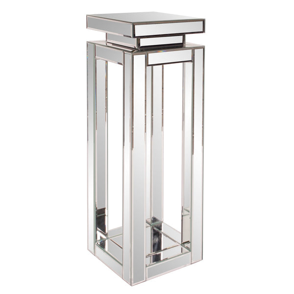 Plinto alto, un gran accesorio que aporta como mesa lateral.